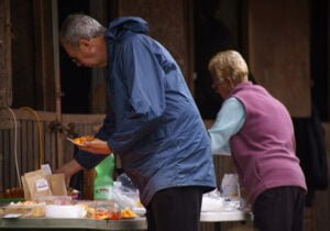 People selecting food from the buffet